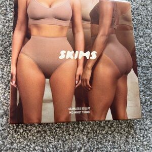 SKIMS Seamless Sculpt Mid Waist Thong in Brown